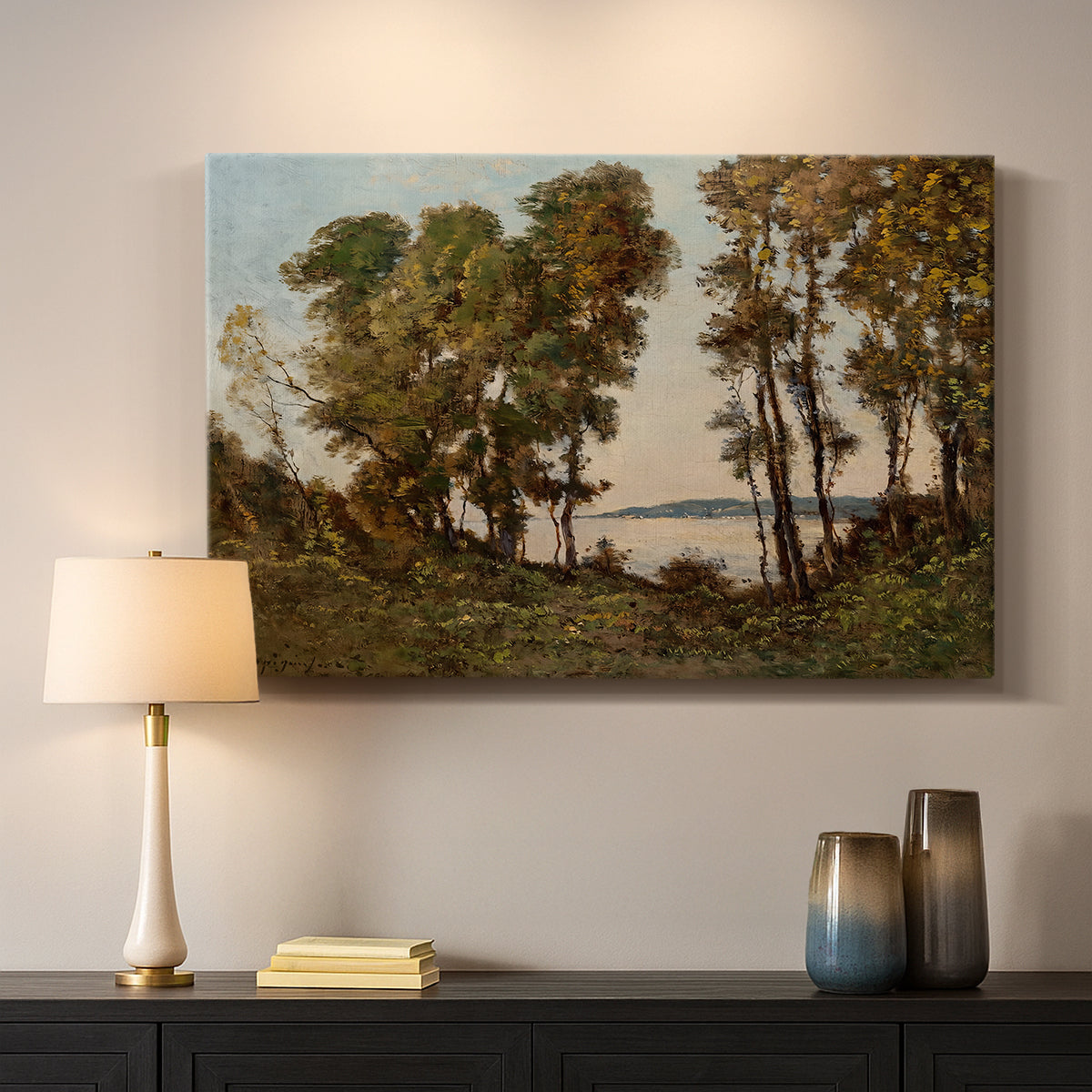 Canvas art print detailing a countryside setting with river and tree-lined banks, mounted in a softly lit interior space
