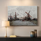 Canvas art print detailing a landscape featuring windmills and low horizon sky, mounted in a softly lit interior space