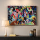 Canvas art print detailing an abstract arrangement with strong movement and color interaction, mounted in a softly lit interior space