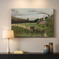 Canvas art print detailing an urban work environment with figures and factory, mounted in a softly lit interior space