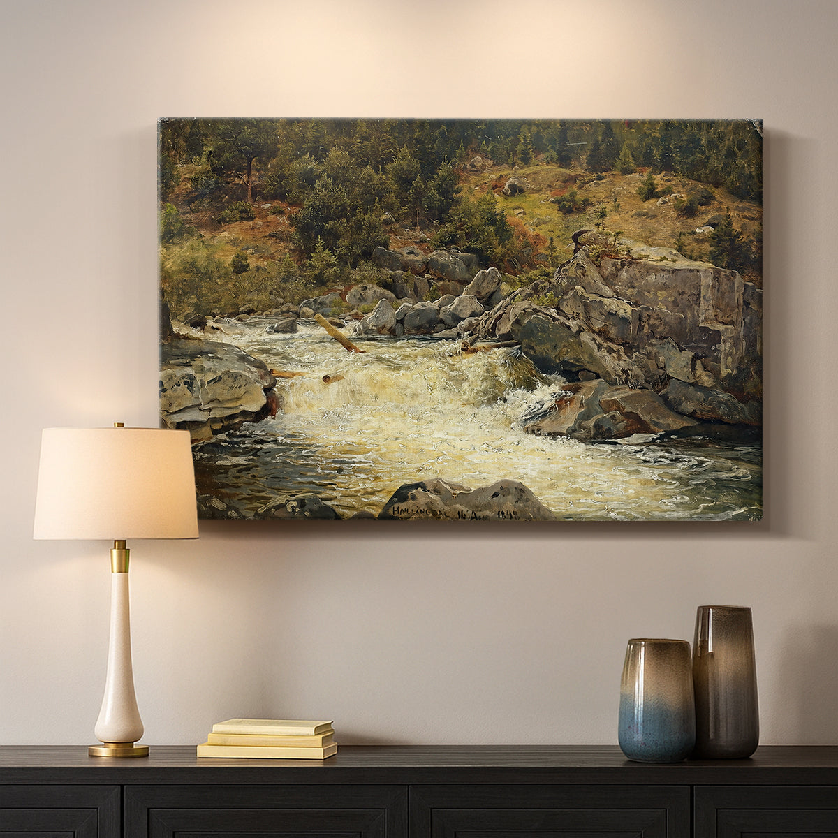 Canvas art print detailing a forested setting with stream descending over rocks, mounted in a softly lit interior space