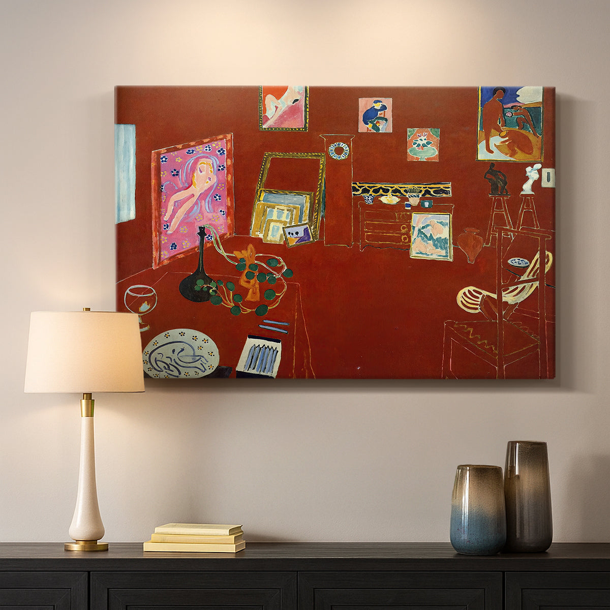 Canvas art print detailing a stylized artist studio dominated by red, mounted in a softly lit interior space