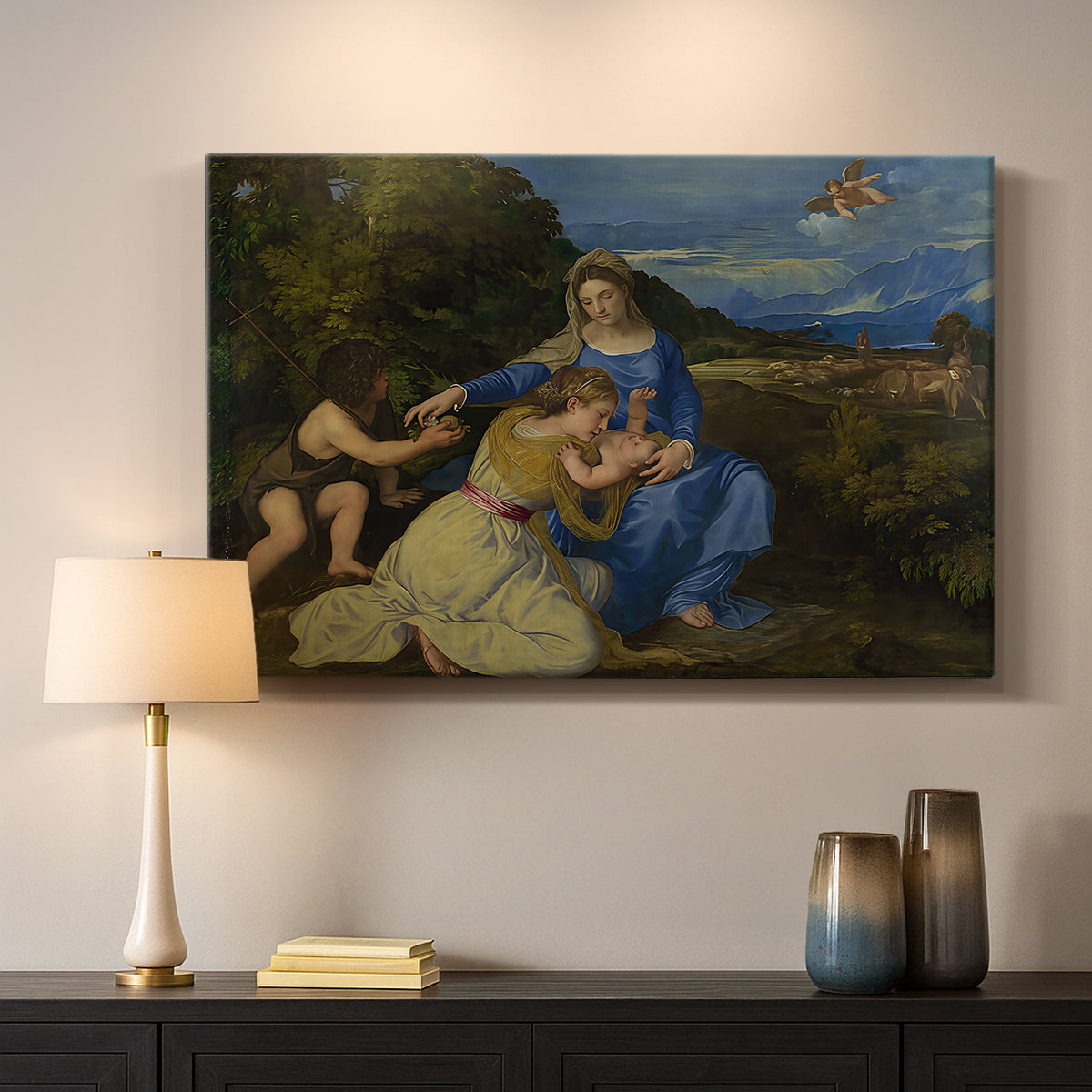 Canvas art print detailing a sacred image of Madonna and child against serene landscape backdrop, mounted in a softly lit interior space