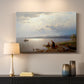 Canvas art print detailing a calm landscape with shoreline activity and soft sky, mounted in a softly lit interior space