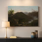 Canvas art print detailing a natural mountain scene illuminated by early morning light, mounted in a softly lit interior space
