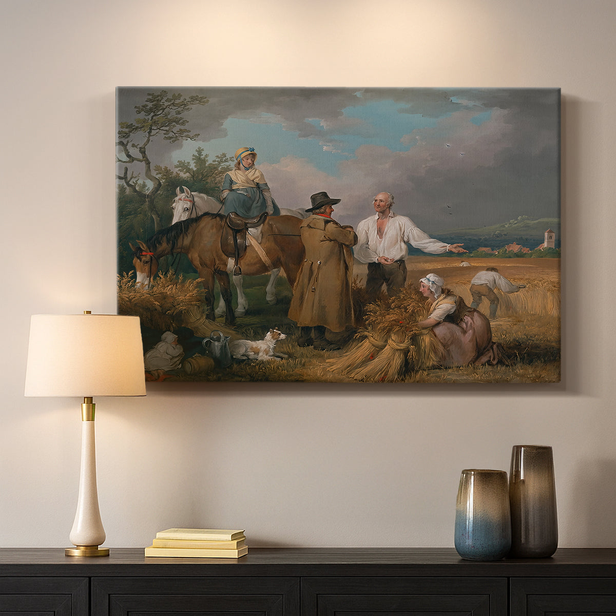 Canvas art print detailing a rural landscape showing agricultural labor, mounted in a softly lit interior space