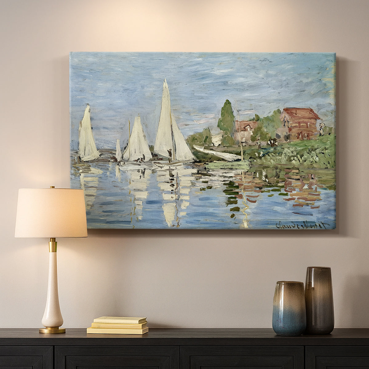 Canvas art print detailing a dynamic nautical scene with boats moving across river, mounted in a softly lit interior space