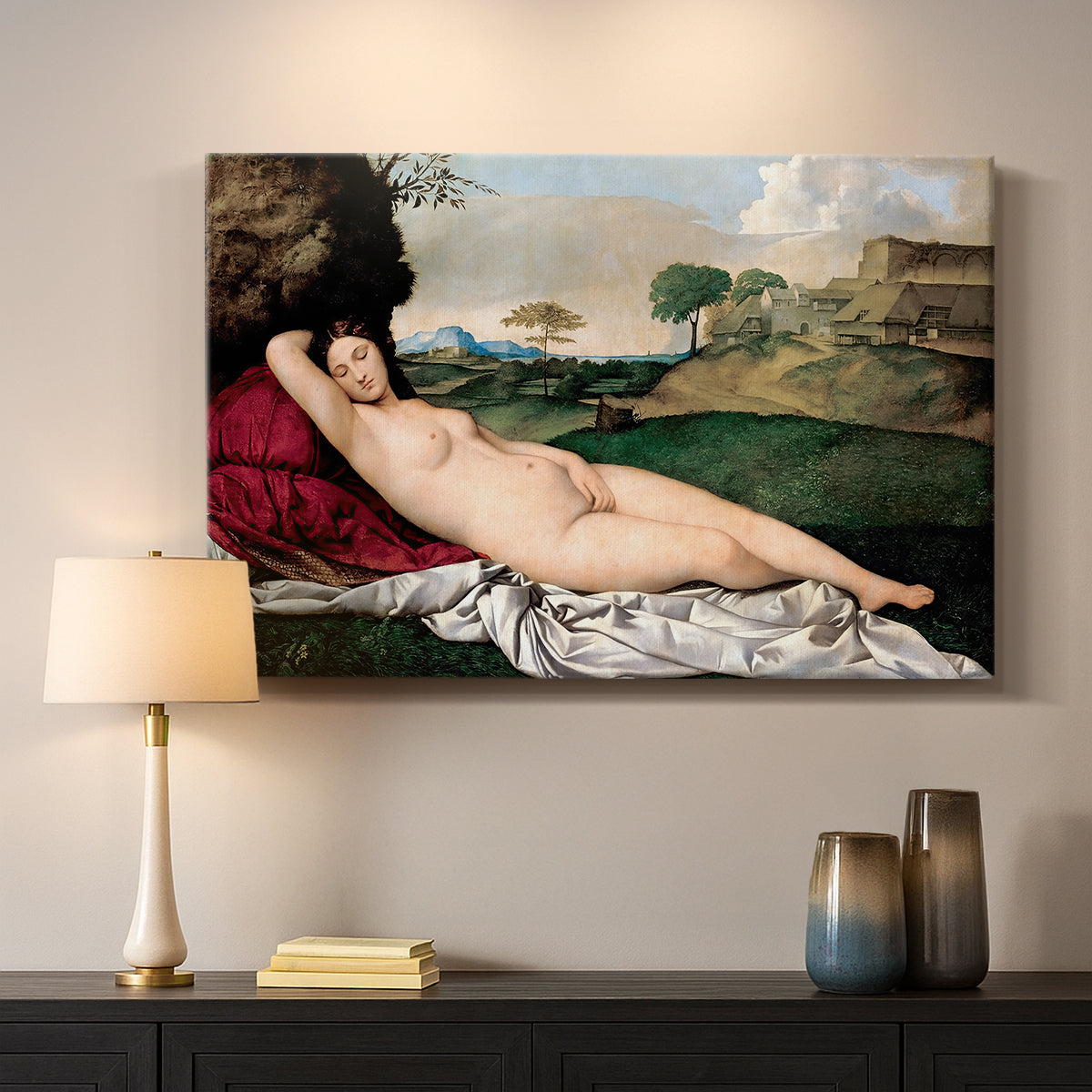 Canvas art print detailing a classical reclining nude surrounded by gentle landscape, mounted in a softly lit interior space