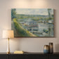 Canvas art print detailing an everyday life scene with boat and figures along river edge, mounted in a softly lit interior space