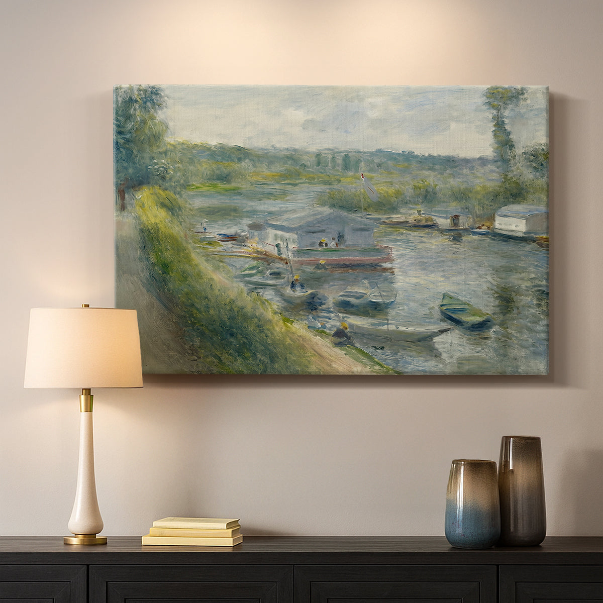 Canvas art print detailing an everyday life scene with boat and figures along river edge, mounted in a softly lit interior space