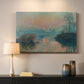 Canvas art print detailing an atmospheric landscape combining cold tones and warm sky, mounted in a softly lit interior space