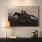 Canvas art print detailing figures on horse moving swiftly through shadowy landscape, mounted in a softly lit interior space
