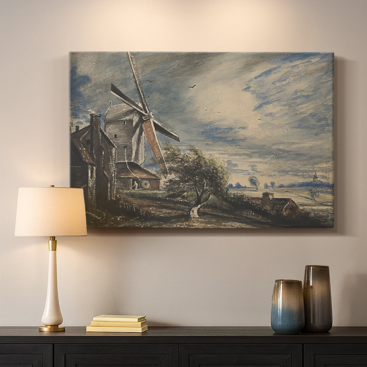 Canvas art print detailing a countryside view with mill and water, mounted in a softly lit interior space