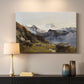 Canvas art print detailing a scenic mountain view with dramatic elevation and depth, mounted in a softly lit interior space