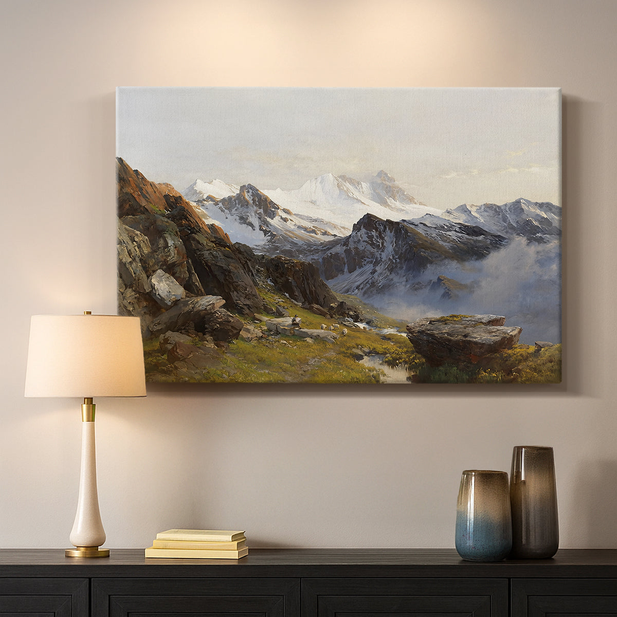 Canvas art print detailing a scenic mountain view with dramatic elevation and depth, mounted in a softly lit interior space