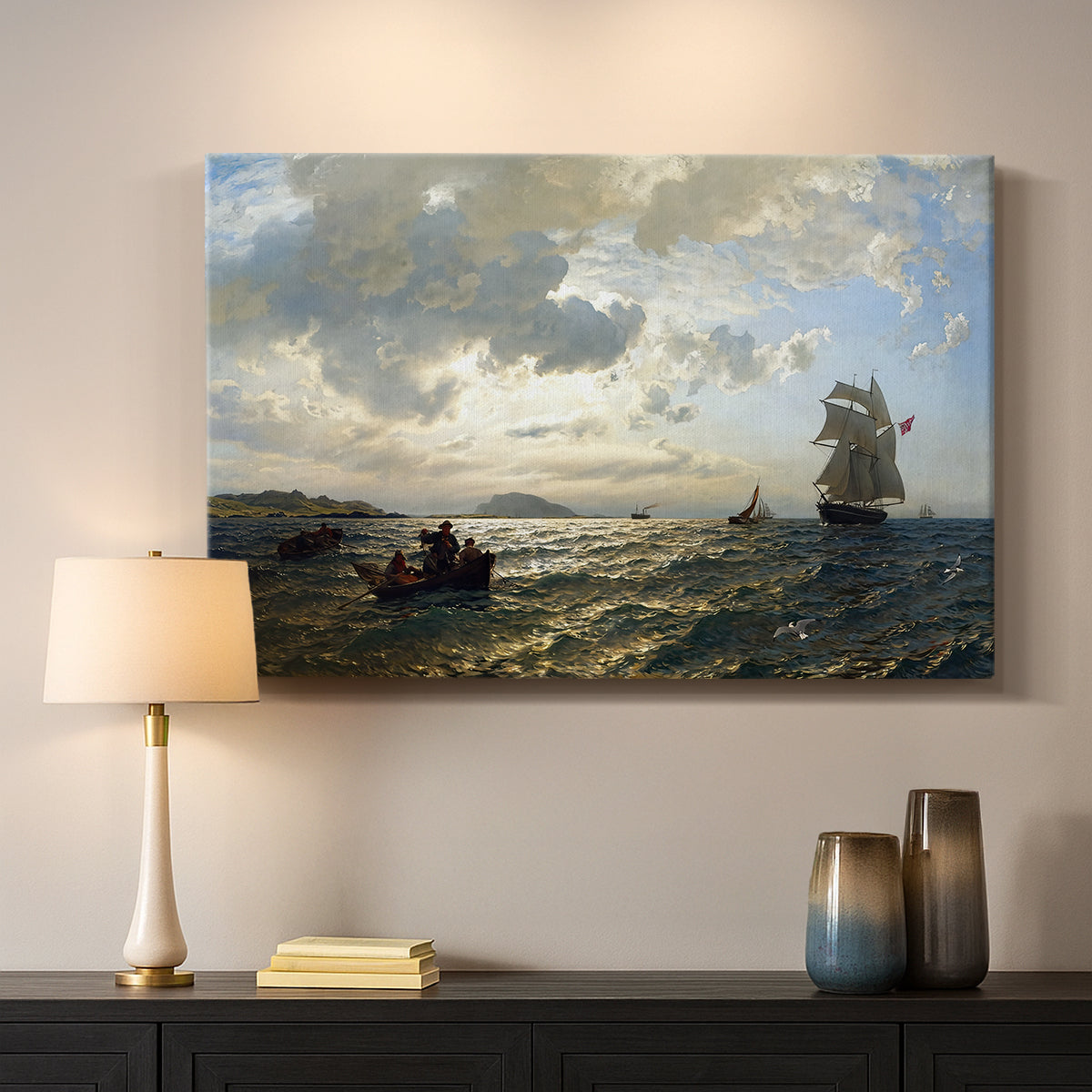 Canvas art print detailing an atmospheric coastal view with motion in sky and sea, mounted in a softly lit interior space