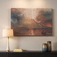 Canvas art print detailing a landscape showing volcanic activity, mounted in a softly lit interior space