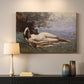 Canvas art print detailing a romantic scene combining human figure and shoreline, mounted in a softly lit interior space