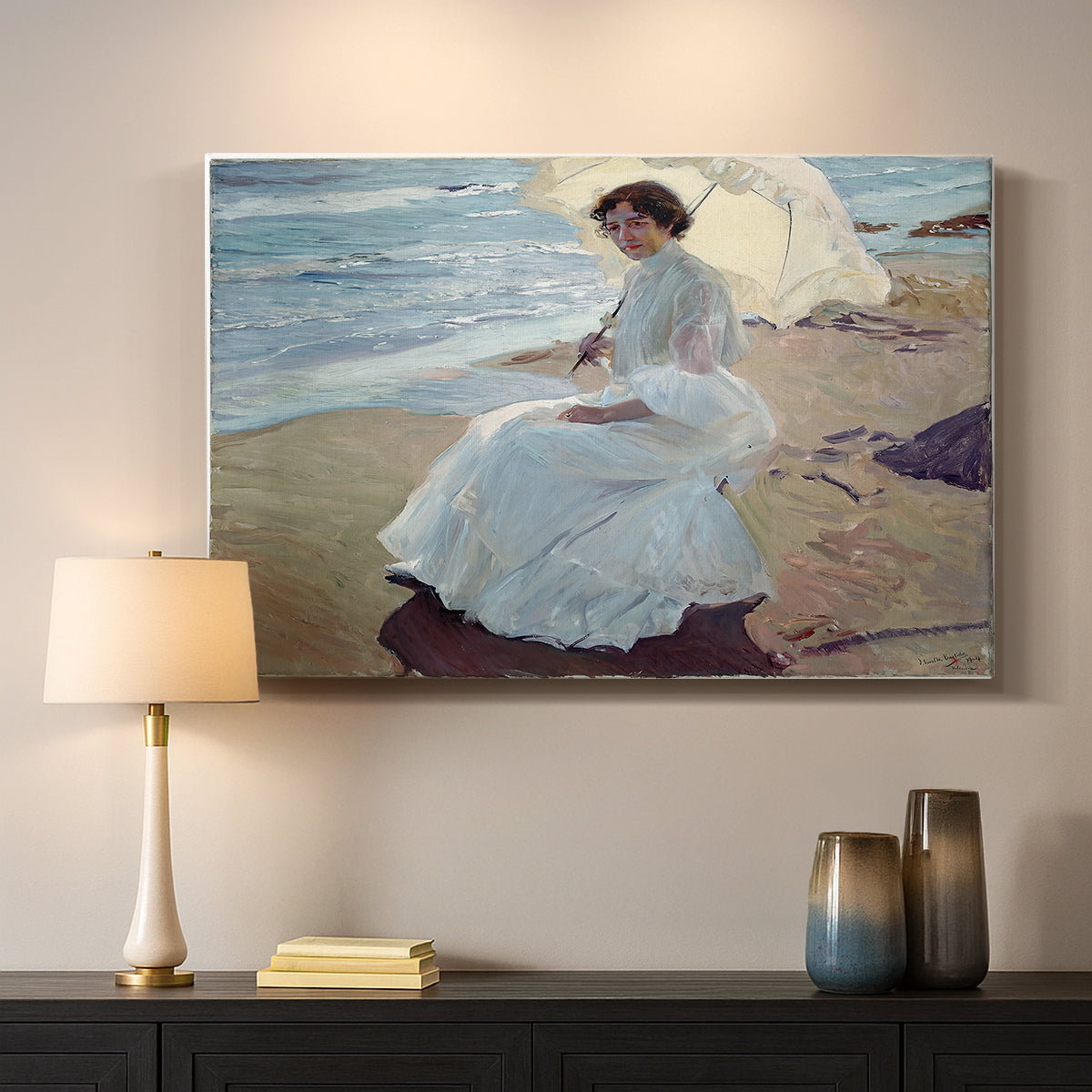 Canvas art print detailing a serene beach scene with single figure and soft light, mounted in a softly lit interior space