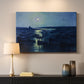 Canvas art print detailing an atmospheric harbor illuminated by moonlight, mounted in a softly lit interior space
