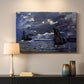 Canvas art print detailing an atmospheric maritime view with ships in moonlit darkness, mounted in a softly lit interior space