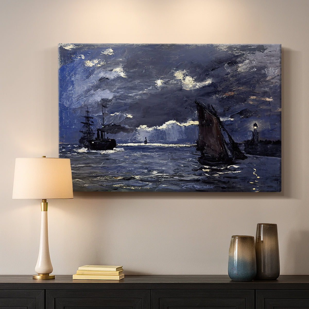 Canvas art print detailing an atmospheric maritime view with ships in moonlit darkness, mounted in a softly lit interior space