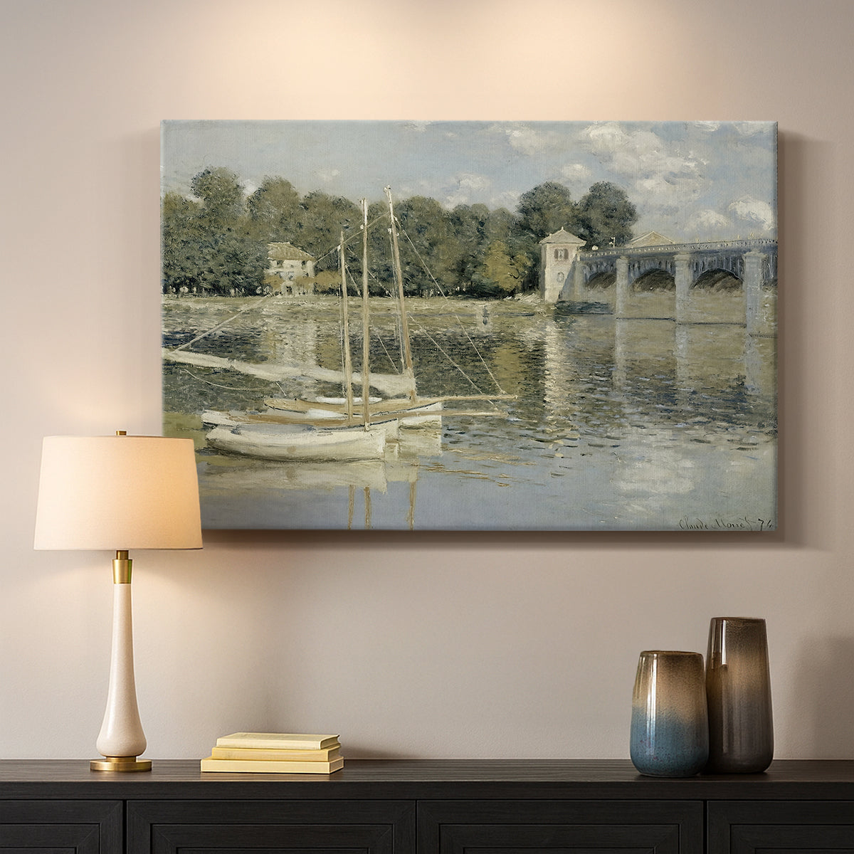 Canvas art print detailing a riverside view with architecture and nautical activity, mounted in a softly lit interior space