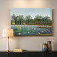 Canvas art print detailing a tropical landscape featuring birds and greenery, mounted in a softly lit interior space