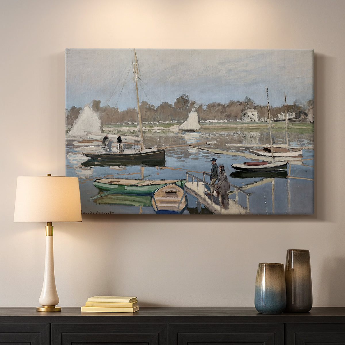 Canvas art print detailing a tranquil river setting with sailboats and shoreline, mounted in a softly lit interior space