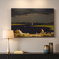Canvas art print detailing a natural scene capturing changing weather, mounted in a softly lit interior space