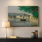 Canvas art print detailing a tranquil scene combining buildings, water, and sky, mounted in a softly lit interior space