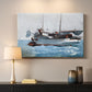 Canvas art print detailing a working vessel scene with people balancing on moving water, mounted in a softly lit interior space