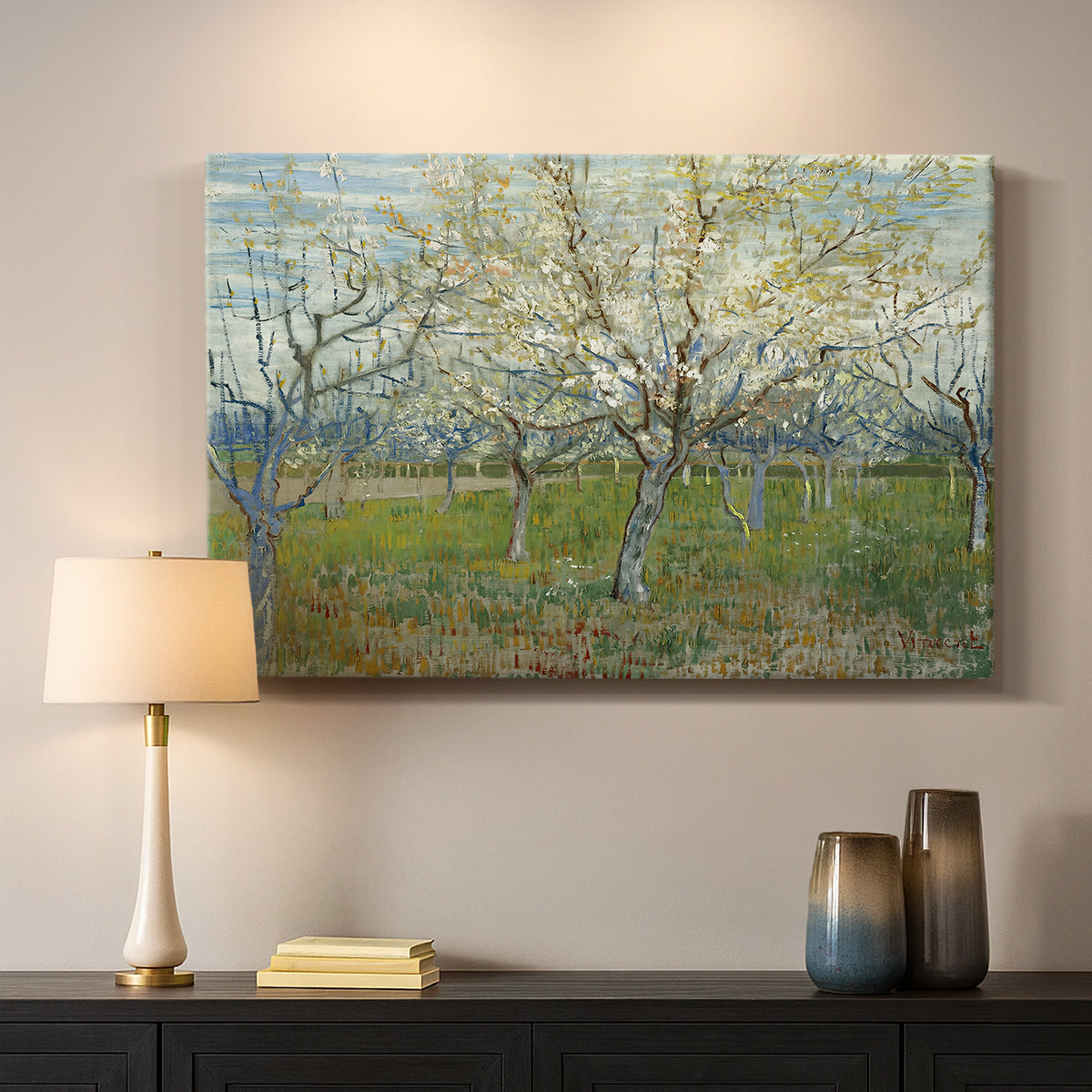 Canvas art print detailing a stylized orchard composition with delicate tones, mounted in a softly lit interior space