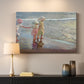 Canvas art print detailing a beach composition with figures and light, mounted in a softly lit interior space