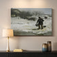 Canvas art print detailing an atmospheric winter landscape with human presence, mounted in a softly lit interior space