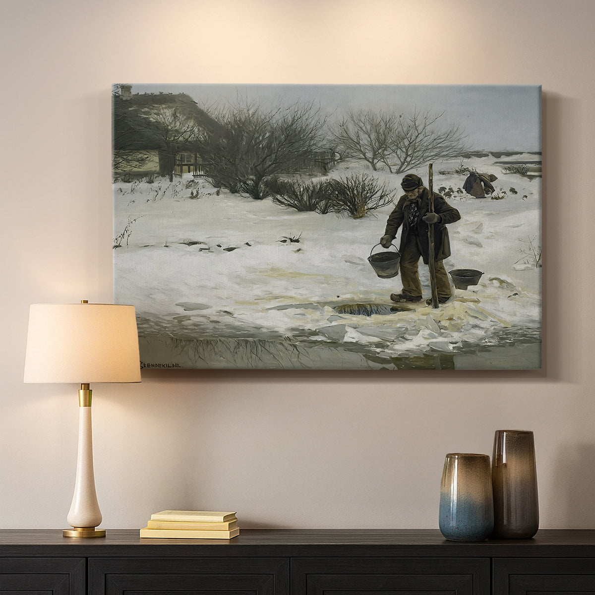 Canvas art print detailing an atmospheric winter landscape with human presence, mounted in a softly lit interior space