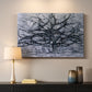 Canvas art print detailing a transitional tree pattern, mounted in a softly lit interior space