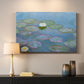 Canvas art print detailing a close-up of aquatic plants in still water, mounted in a softly lit interior space