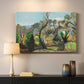 Canvas art print detailing an open terrain scene with trees and atmospheric depth, mounted in a softly lit interior space