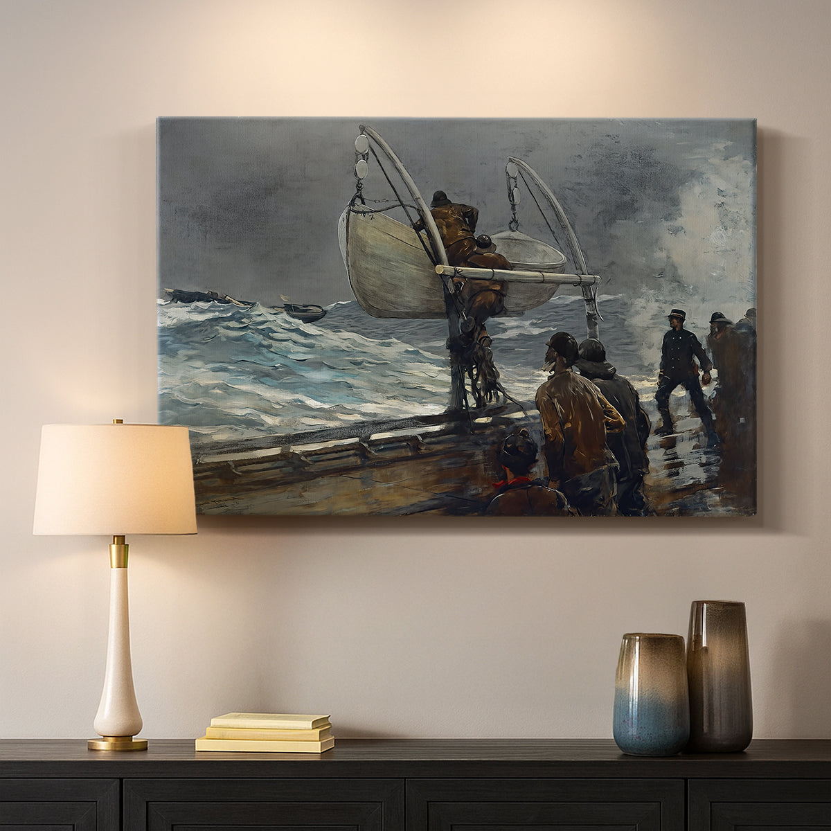 Canvas art print detailing a dramatic seaside moment with figures and distant ship, mounted in a softly lit interior space