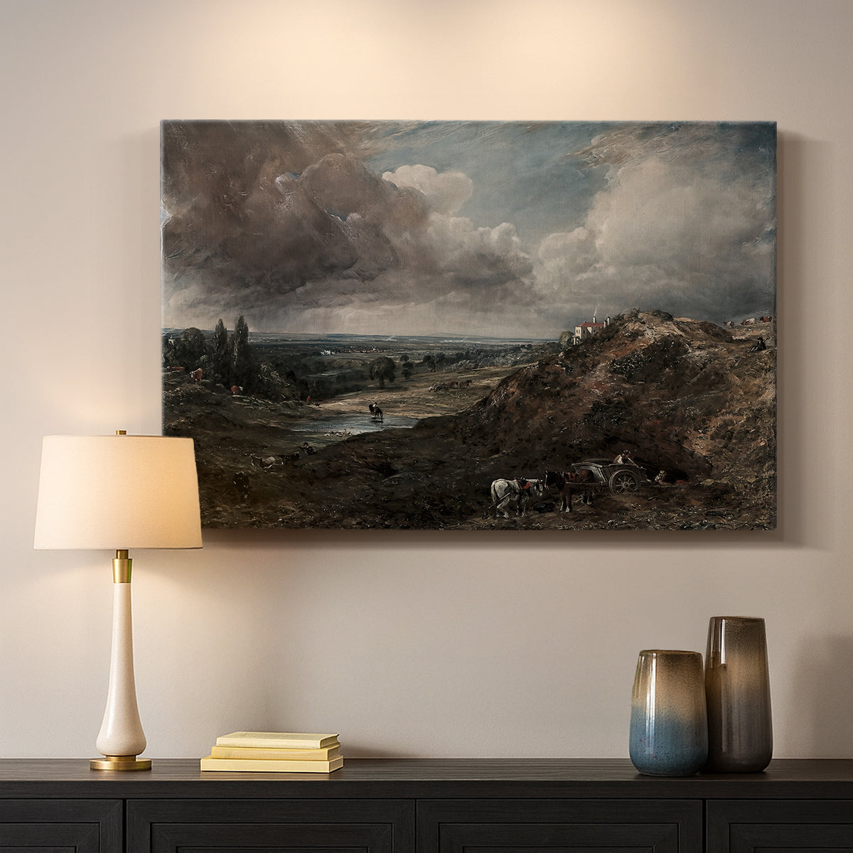 Canvas art print detailing a countryside view emphasizing water and sky, mounted in a softly lit interior space