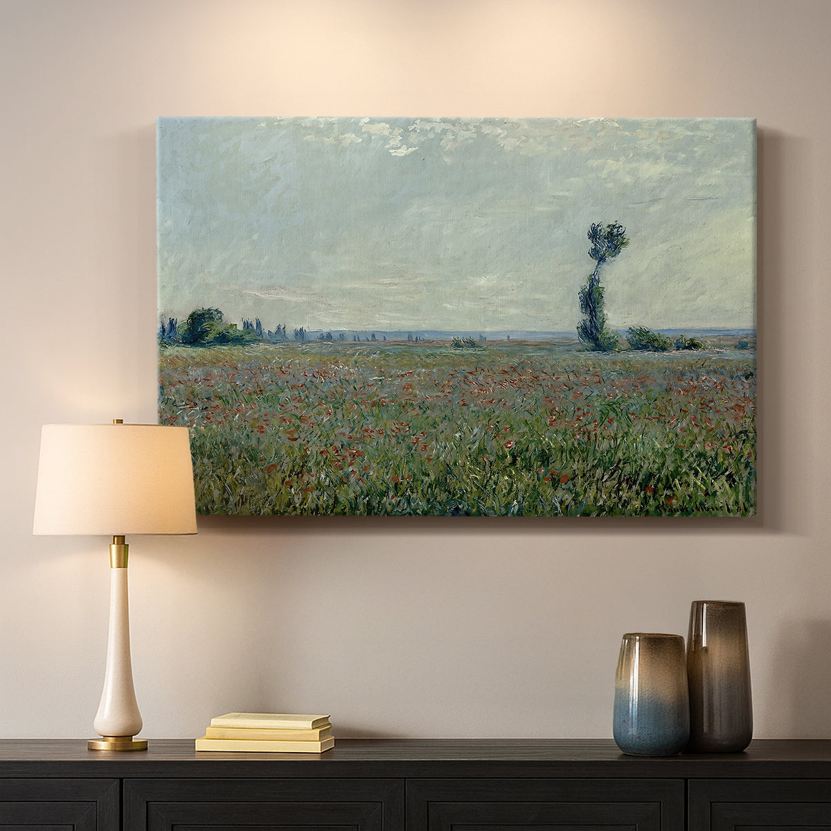 Canvas art print detailing a natural field scene with vibrant red flowers, mounted in a softly lit interior space