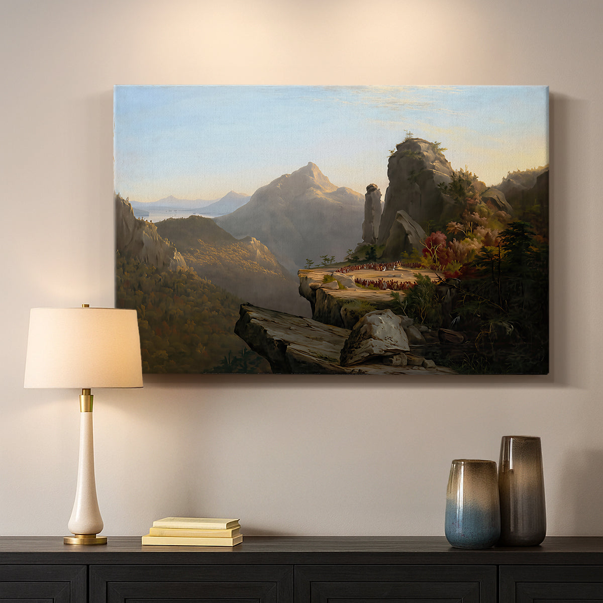 Canvas art print detailing a narrative outdoor scene set in a mountainous river valley, mounted in a softly lit interior space