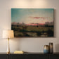 Canvas art print detailing a peaceful marsh setting, mounted in a softly lit interior space
