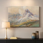 Canvas art print detailing a realistic mountain view with strong geological forms, mounted in a softly lit interior space