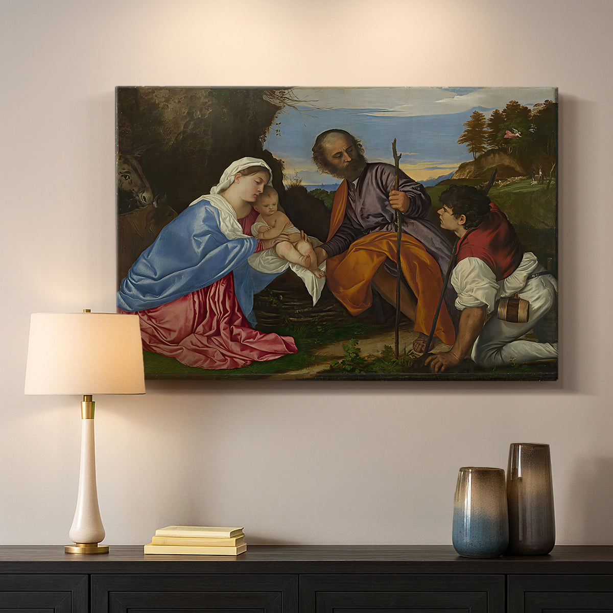 Canvas art print detailing a Renaissance countryside scene with holy family and visitor, mounted in a softly lit interior space