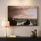 Canvas art print detailing an expansive seascape with light breaking through clouds, mounted in a softly lit interior space