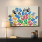 Canvas art print detailing a stylized collage resembling leaves, mounted in a softly lit interior space