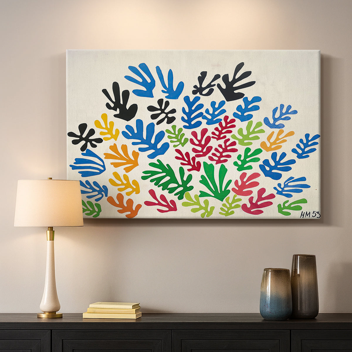 Canvas art print detailing a stylized collage resembling leaves, mounted in a softly lit interior space