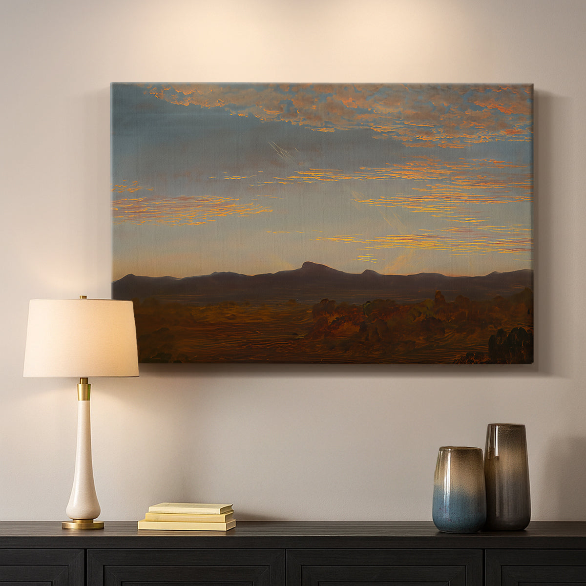 Canvas art print detailing a panoramic natural view with low mountains and open plain, mounted in a softly lit interior space